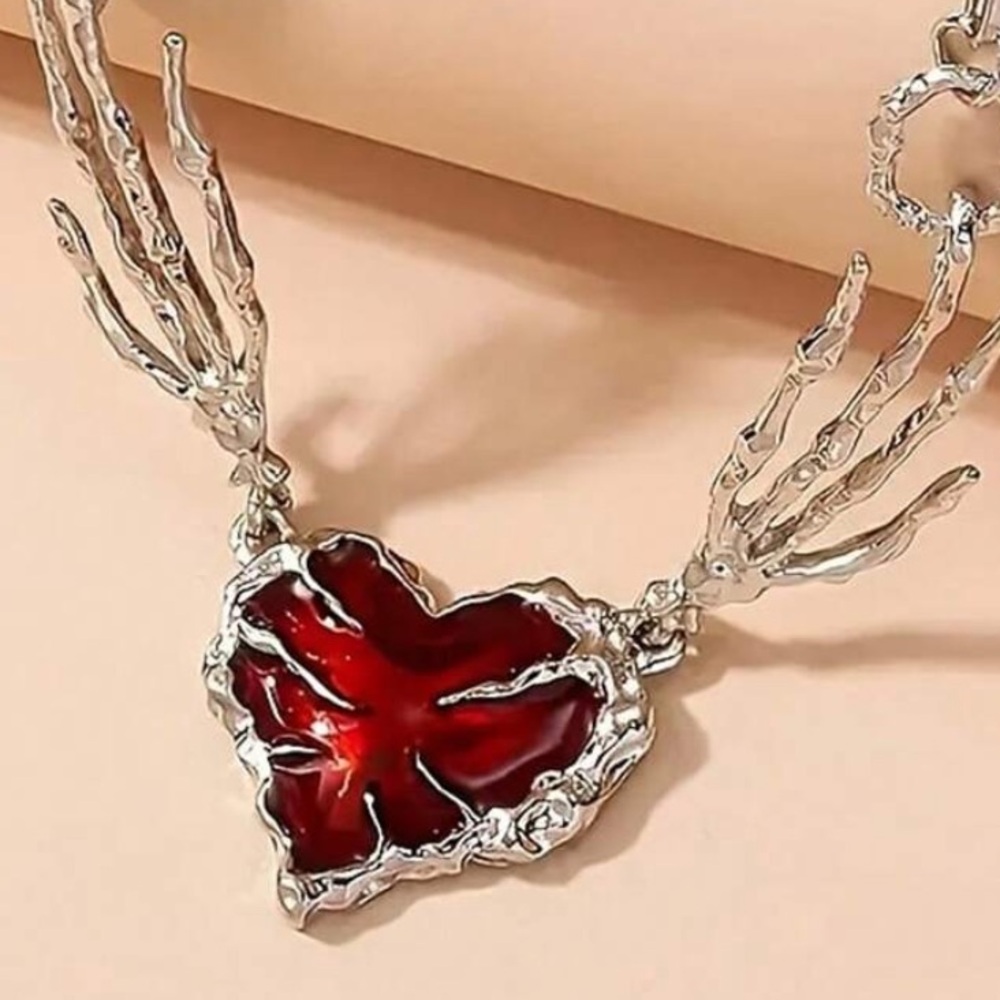 Skeleton Hands Holding Red Heart Necklace